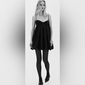 H&M short dress in black satin..Lined